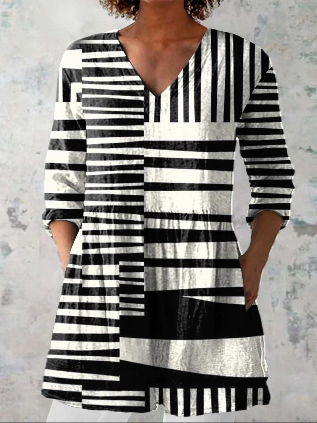 Blusa lunga fluida con scollo a V da donna