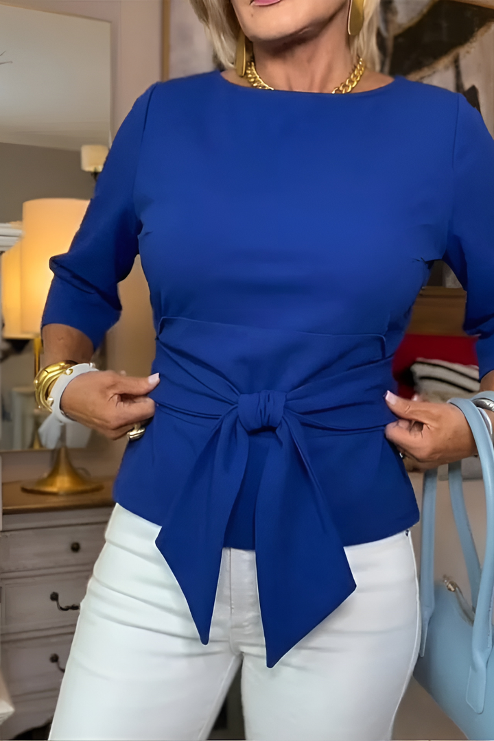 Blusa de mujer con peplum, mangas largas y lazo en la cintura