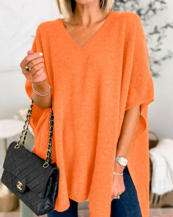 Maglione da donna ampio con scollo a V e taglio fluido