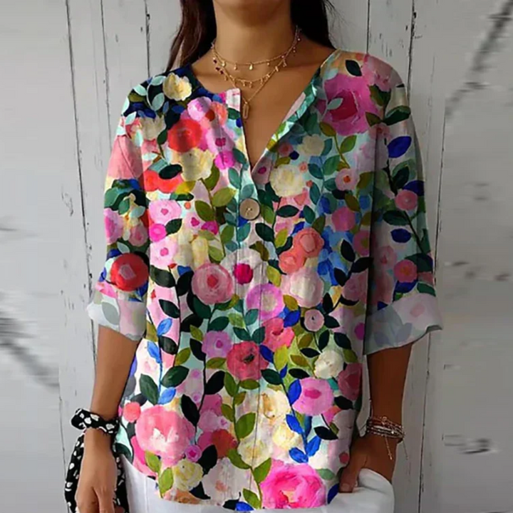 Blusa donna con stampa floreale e maniche corte