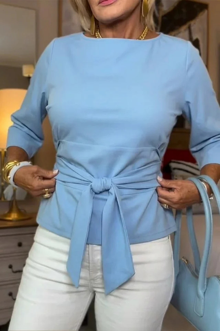 Blusa de mujer con peplum, mangas largas y lazo en la cintura