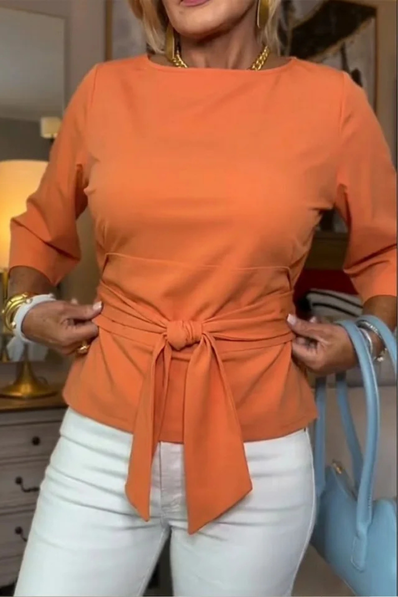 Blusa de mujer con peplum, mangas largas y lazo en la cintura