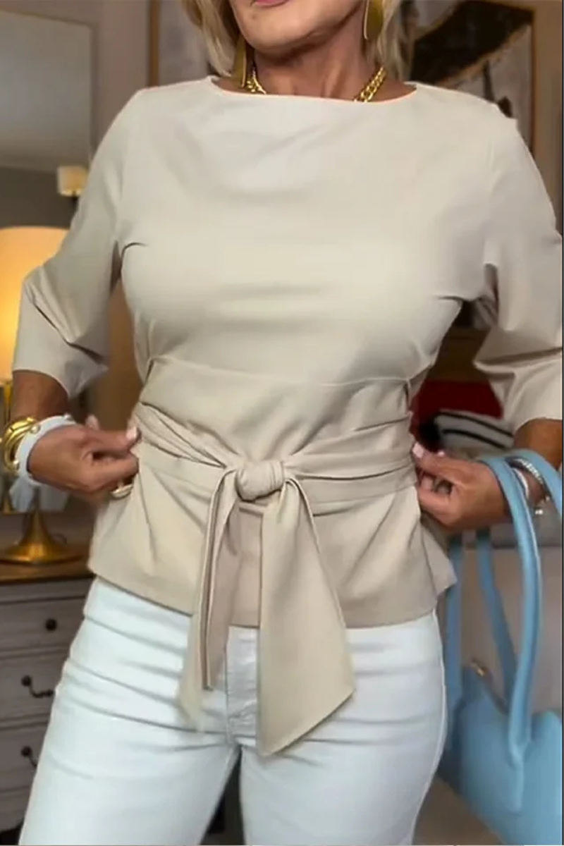 Blusa de mujer con peplum, mangas largas y lazo en la cintura