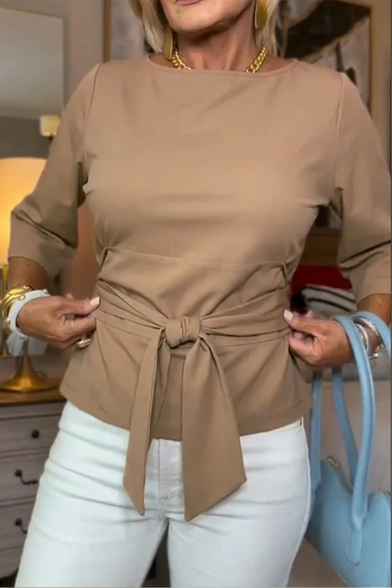 Blusa de mujer con peplum, mangas largas y lazo en la cintura