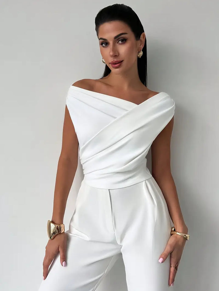 Elegantní top s volánem na rameni