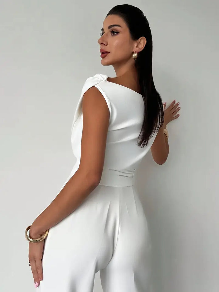Elegantní top s volánem na rameni