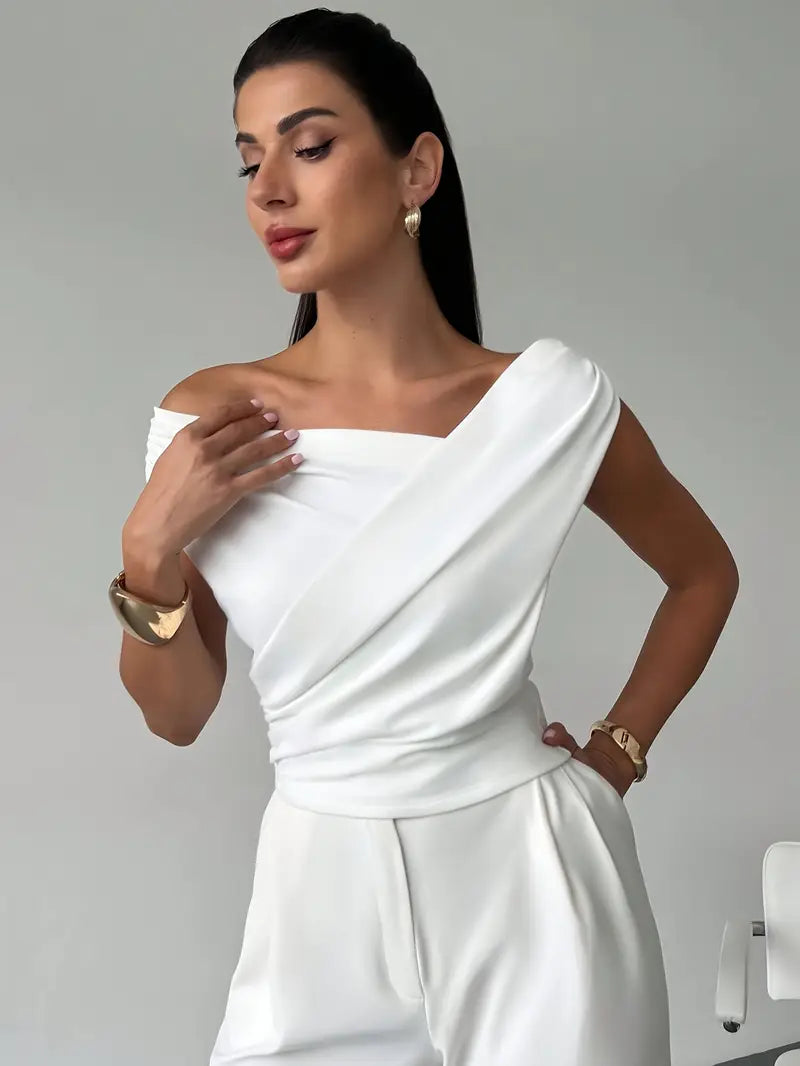 Elegantní top s volánem na rameni