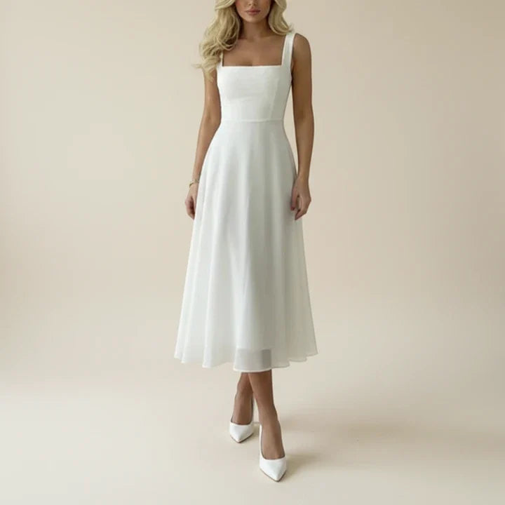 Elegantní midi šaty bez rukávů v bílé a černé barvě pro ženy