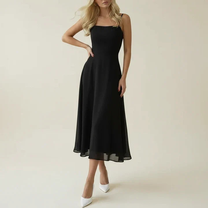 Elegantní midi šaty bez rukávů v bílé a černé barvě pro ženy