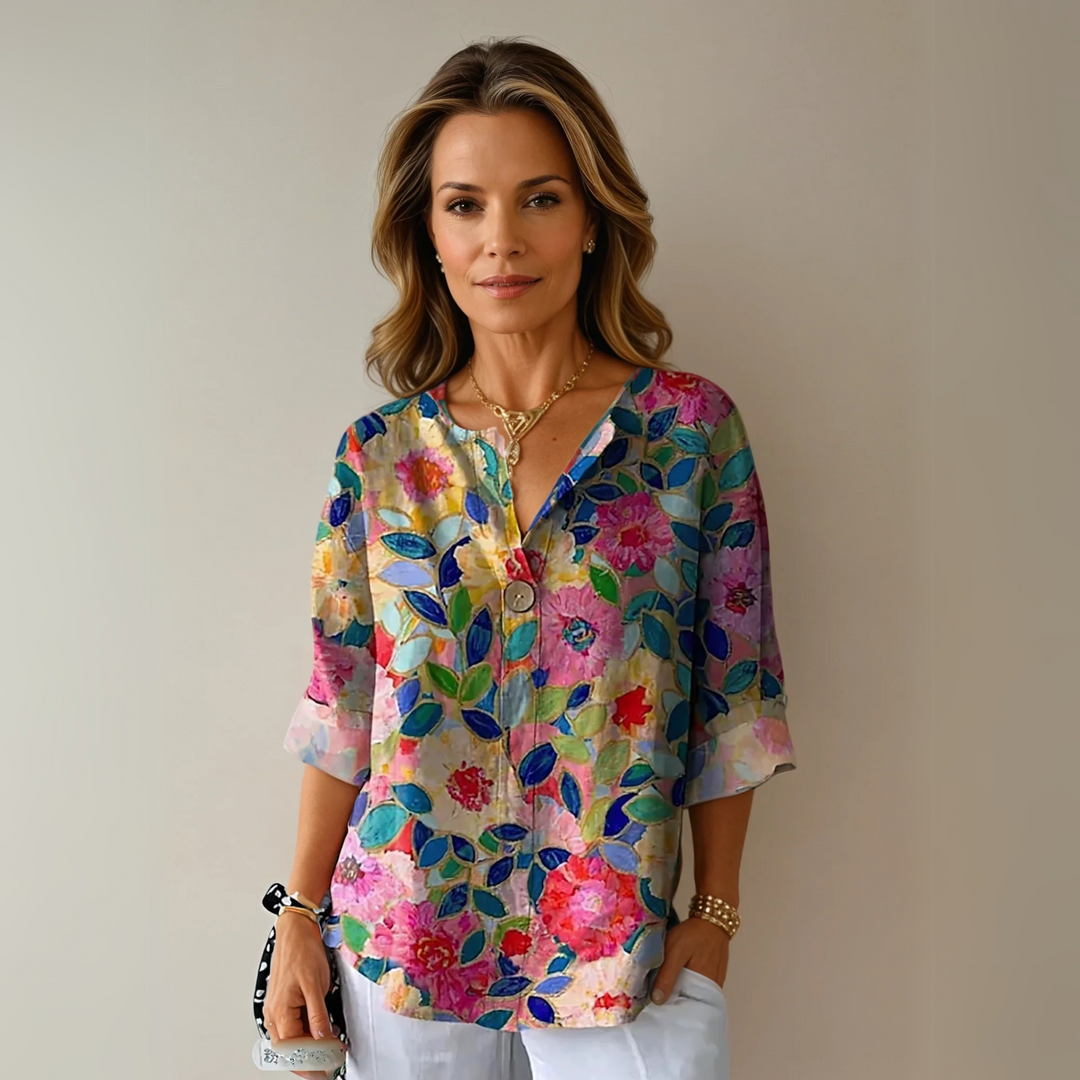 Blusa donna con stampa floreale e maniche corte